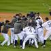 The Detroit Tigers celebrate beating the Yankees 8-1 during Game 4 of the ALCS and clinching a spot in the World Series at Comerica Park in Detroit on Thursday night.